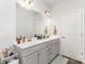 Bright bathroom featuring a double sink vanity with white countertops and ample storage in a modern style at 156 Sugar Hill Rd, Troutman, NC 28166