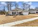 Charming one-story home with a well-manicured front yard and a two-car garage at 156 Sugar Hill Rd, Troutman, NC 28166