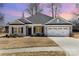 Charming one-story home with attached garage, landscaped yard, and neutral siding, perfect for modern living at 156 Sugar Hill Rd, Troutman, NC 28166