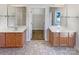 Bathroom featuring dual vanities, and a doorway to a closet at 15604 Waterfront Dr, Huntersville, NC 28078
