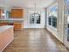 Bright dining area features hardwood floors, large windows, and updated lighting at 15604 Waterfront Dr, Huntersville, NC 28078