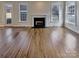Spacious living room with hardwood floors and large windows, offering plenty of natural light at 15604 Waterfront Dr, Huntersville, NC 28078