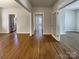 Open living space with hardwood floors connecting the kitchen and other rooms at 15604 Waterfront Dr, Huntersville, NC 28078