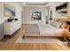 Serene main bedroom with tray ceiling, wood floors, and a neutral color palette at 15604 Waterfront Dr, Huntersville, NC 28078