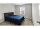 Bedroom with dark blue bed set, carpet and double hung window at 2116 Belterra Dr, Charlotte, NC 28216