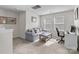Bonus room with seating area, desk, and natural light from large window at 2116 Belterra Dr, Charlotte, NC 28216