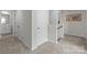 Upstairs hallway with multiple closets leading to bathroom at 2116 Belterra Dr, Charlotte, NC 28216