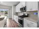 Well-equipped kitchen with stainless steel appliances, stone countertops, and ample cabinet space at 2116 Belterra Dr, Charlotte, NC 28216
