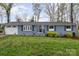 Charming single story blue brick home with a well-manicured lawn and appealing curb appeal at 2156 Flynn Dr, Gastonia, NC 28054