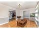 Open-concept living room with hardwood floors and views into the kitchen and dining room at 2156 Flynn Dr, Gastonia, NC 28054