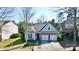 An aerial view of a cozy home with a well-maintained lawn and two-car garage at 2316 Winding River Dr, Charlotte, NC 28214