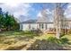 Lush backyard with a deck, well-maintained lawn and solar panels offering a serene and private outdoor space at 2316 Winding River Dr, Charlotte, NC 28214