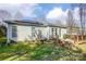 Spacious backyard with a deck, solar panels, and well-manicured lawn that offers plenty of room for outdoor activities at 2316 Winding River Dr, Charlotte, NC 28214
