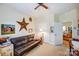 Bedroom featuring lots of decor, a leather couch and carpeted floors at 2316 Winding River Dr, Charlotte, NC 28214