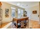 Sunny breakfast nook features a round table and chairs near French doors at 2316 Winding River Dr, Charlotte, NC 28214