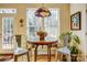 Bright breakfast nook features a round table and an ornate hanging lamp at 2316 Winding River Dr, Charlotte, NC 28214