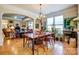 Bright dining room features hardwood floors, large windows, and an elegant chandelier at 2316 Winding River Dr, Charlotte, NC 28214