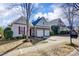 Inviting home with a two-car garage, beautiful landscaping, and a cozy, neighborhood feel at 2316 Winding River Dr, Charlotte, NC 28214