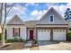 Charming single-Gathering home featuring a two-car garage and manicured lawn at 2316 Winding River Dr, Charlotte, NC 28214