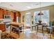 Sunlit kitchen features stainless appliances, wood cabinetry, and an island at 2316 Winding River Dr, Charlotte, NC 28214