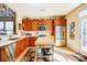 Kitchen with stainless appliances, wood cabinets, kitchen island, and white countertops at 2316 Winding River Dr, Charlotte, NC 28214