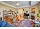 Cozy living room with a fireplace, entertainment center, and hardwood floors at 2316 Winding River Dr, Charlotte, NC 28214