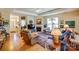 Bright and airy living room with a fireplace, large windows, and comfortable seating at 2316 Winding River Dr, Charlotte, NC 28214