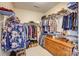 Walk-in closet with ample storage space and multiple levels of shelving and racks at 2316 Winding River Dr, Charlotte, NC 28214