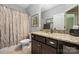 Bathroom boasting a granite vanity top, dark wood cabinetry, and a shower and tub at 2455 Seagull Dr # 62, Denver, NC 28037