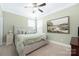 Bedroom featuring a queen size bed with an upholstered headboard and a ceiling fan at 2455 Seagull Dr # 62, Denver, NC 28037