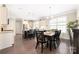 Open concept kitchen and breakfast area with hardwood floors and natural lighting at 2455 Seagull Dr # 62, Denver, NC 28037
