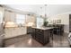 Bright kitchen featuring granite counters, stainless steel appliances, and a central island at 2455 Seagull Dr # 62, Denver, NC 28037