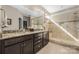 Main bathroom featuring dual vanities, granite countertops, and a walk-in shower at 2455 Seagull Dr # 62, Denver, NC 28037