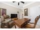 Office with brown desk and chair, and a comfortable recliner at 2455 Seagull Dr # 62, Denver, NC 28037