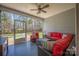Screened porch featuring a ceiling fan, and a large seating area with comfortable furniture at 2455 Seagull Dr # 62, Denver, NC 28037