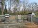 Back deck featuring grill, chairs, and view to the backyard at 2602 Cherokee Ct, Gastonia, NC 28056