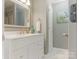 Bathroom featuring modern vanity with a large mirror, neutral tones, and sleek fixtures at 2602 Cherokee Ct, Gastonia, NC 28056