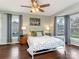 Serene bedroom with hardwood floors, modern decor, and ample natural light for a relaxing retreat at 2602 Cherokee Ct, Gastonia, NC 28056