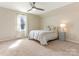 Bright bedroom featuring a ceiling fan and carpet floors at 2602 Cherokee Ct, Gastonia, NC 28056