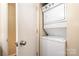 This laundry room features a stacked washer and dryer unit, optimizing space and adding convenience at 2609 Eastway Dr # A, Charlotte, NC 28205