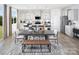 Open-concept kitchen with modern appliances, a large island, and a dining area with bench seating at 2640 Tillman N St, Monroe, NC 28112