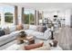 Spacious living room with natural light, a comfortable sectional sofa, and views of the outdoors at 2640 Tillman N St, Monroe, NC 28112