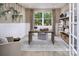 Bright home office with natural light, a modern desk, decor, and stylish built-in shelving at 2640 Tillman N St, Monroe, NC 28112