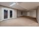 Spacious basement with outdoor access through French doors and a large window at 2835 Peverell Ln, Charlotte, NC 28270