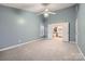 Spacious bedroom with neutral carpet and attached ensuite bathroom at 2835 Peverell Ln, Charlotte, NC 28270