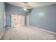 A spacious bedroom boasts an ensuite bathroom with a double vanity and a ceiling fan at 2835 Peverell Ln, Charlotte, NC 28270