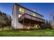 An elevated wooden deck adds charm to the exterior, overlooking the yard with a dark metal fence at 2835 Peverell Ln, Charlotte, NC 28270