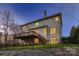 A large wooden deck on the home's rear exterior overlooks a landscaped yard with dark metal fencing at 2835 Peverell Ln, Charlotte, NC 28270