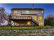 A large, elevated wooden deck enhances the home's exterior with stairs and a fenced backyard at 2835 Peverell Ln, Charlotte, NC 28270