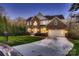 Charming two-story brick home with a well-manicured lawn and an attached two-car garage at 2835 Peverell Ln, Charlotte, NC 28270